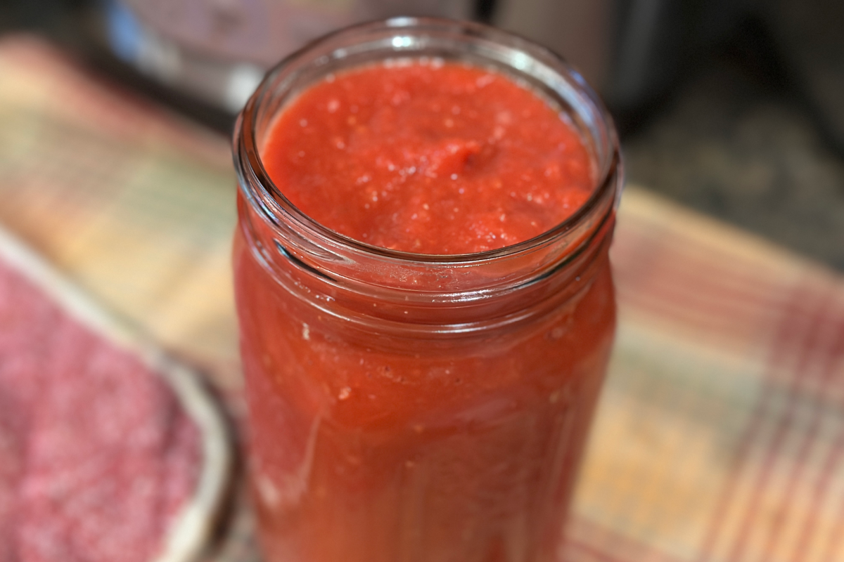 Closeup image of tomato sauce in jar