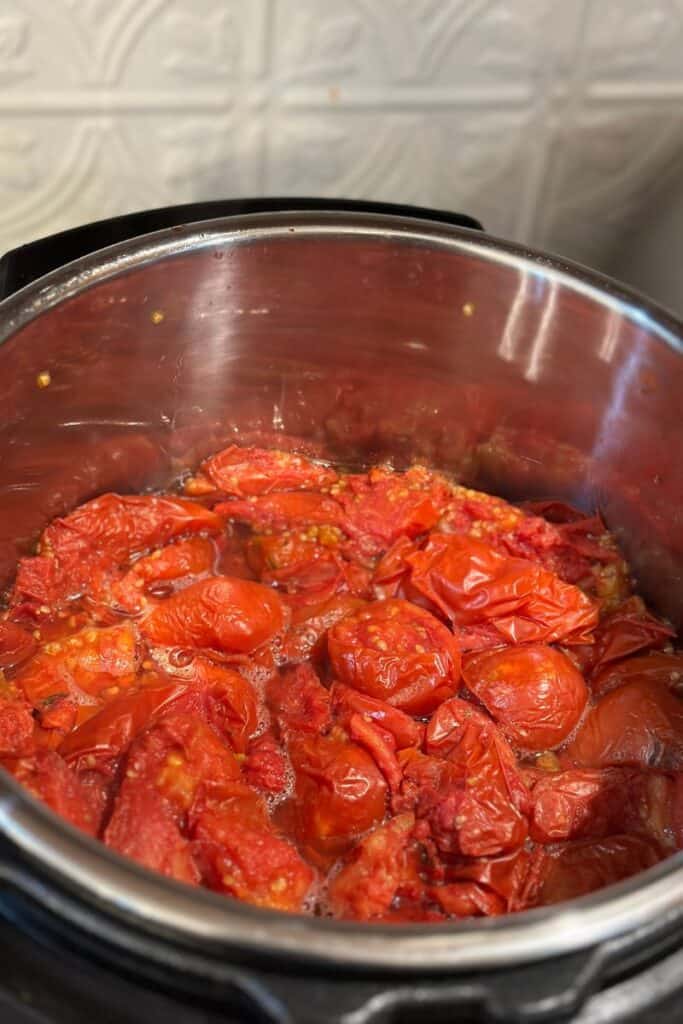 Shruken tomatoes in an Instant Pot, ready to puree.