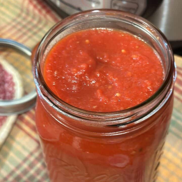 thick tomato sauce in a quart jar