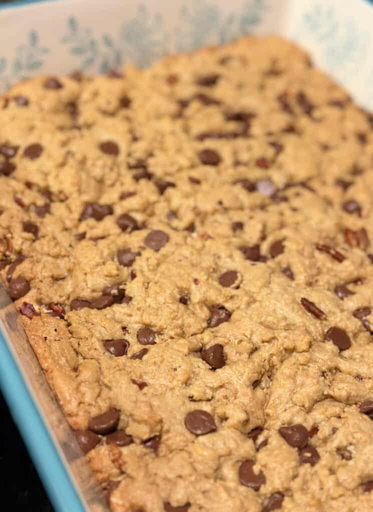 Freshly baked whole wheat chocolate chip cookie bars in 9x11 pan