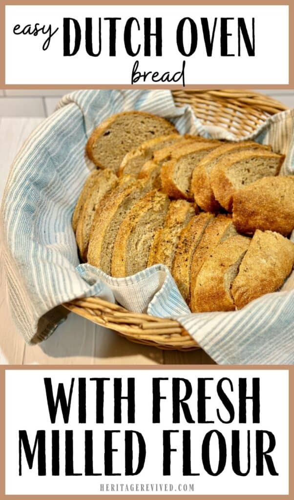 Vertical graphic with whole wheat dutch oven bread sliced in a basket with a tea towel with text "Easy Dutch Oven bread with Fresh Milled Flour"