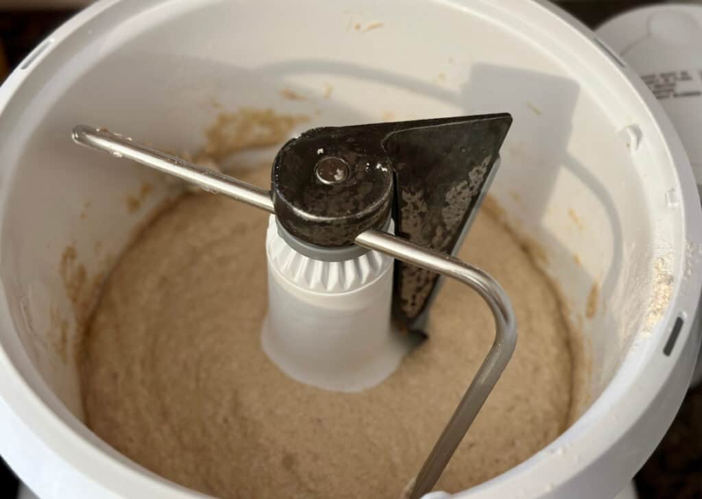 Half of flour mixed with hot water, resting during sponge process.