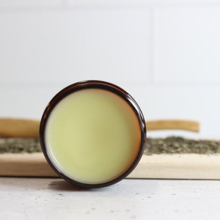 Lemon balm lip balm in amber glass container.