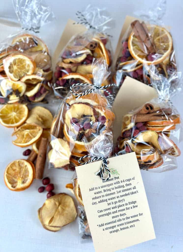 Several simmer pot gift bags filled with dried fruit and spices.