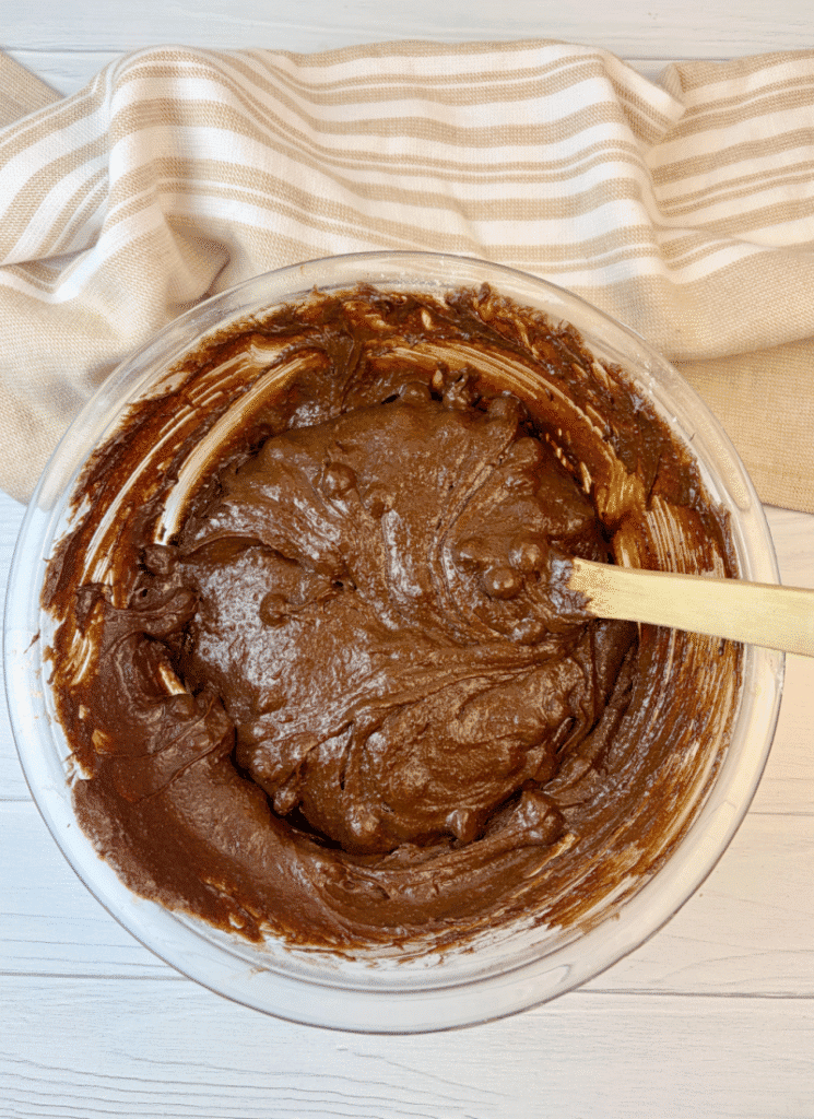 Mixing in chocolate chips into fresh milled brownie batter.